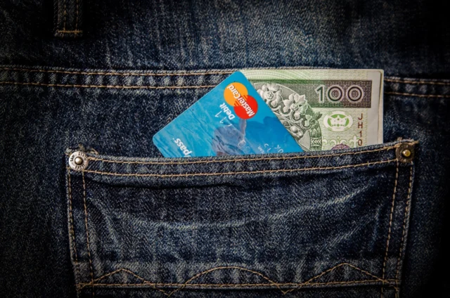 Person reviewing a credit card statement, a key step to avoid 0% APR credit card mistakes
