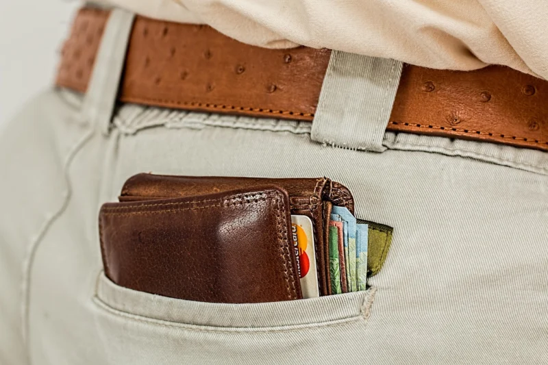 Person reviewing financial documents and a laptop, planning how many 0% APR cards to apply for