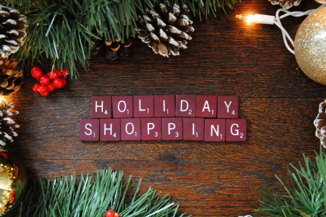 Wrapped holiday gifts and shopping bags representing a 0% APR card for holiday shopping strategy